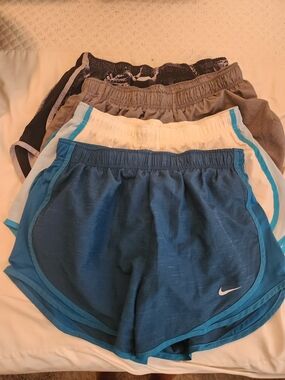 4 Pair Of Nike Shorts. Gray, White, Teal, Black Athletic Shorts